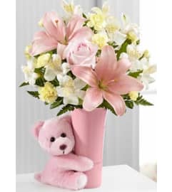Baby Girl Hug. An arrangement by Avenue Flowers and Gifts. Baby Girl Hug. An arrangement by Avenue Flowers and Gifts.