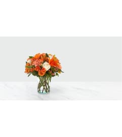 FALLING INTO AUTUMN. An arrangement by J.D. Ballantine's Flowers and Gifts.
