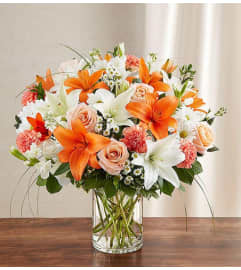 SINCEREST SORROW ORANGE. An arrangement by J.D. Ballantine's Flowers and Gifts.