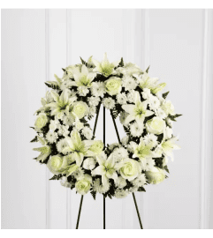 The Treasured Tribute™ Wreath by FTD. An arrangement by Roma James Gifts.