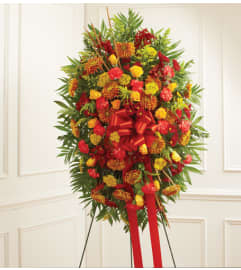 Standing Spray In Fall Colors. An arrangement by Elegant Florist.