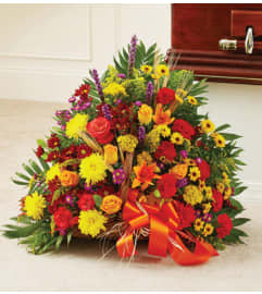 Fireside Basket in Fall Colors. An arrangement by Elegant Florist.