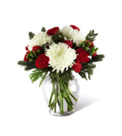 The Holiday Enchantment™ Arrangement by FTD. An arrangement by Roma James Gifts.