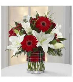 Christmas Giving. An arrangement by The Greenhouse Florist.