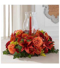 Harvest Hurricane Centerpiece. An arrangement by Love Story Florist.