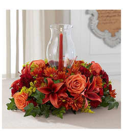 Harvest Hurricane Centerpiece. An arrangement by Love Story Florist.