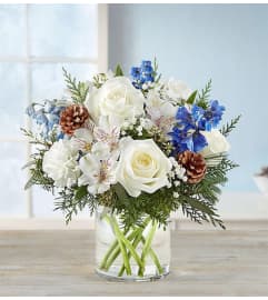 WINTER FILLED WISHES. An arrangement by J.D. Ballantine's Flowers and Gifts.