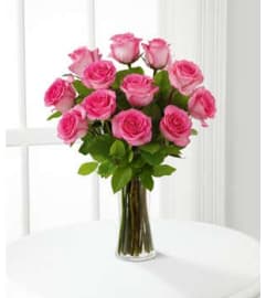 ELEGANT CLASSIC PINK ROSES. An arrangement by Elegant Florist.