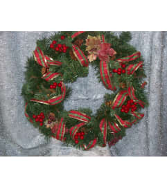 Christmas berry wreath. An arrangement by Country Garden Floral Boutique.