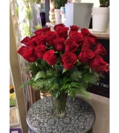 Beautiful 24 red roses in vase. An arrangement by Vivian Flowers.
