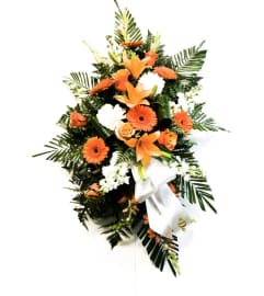 Orange Sunset Standing Spray. An arrangement by Owen Sound Flowers.