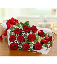 DOZEN RED ROSES WRAPPED TO PRESENT AND ARRANGE AT HOME. An arrangement by Flowers by Priscilla. DOZEN RED ROSES WRAPPED TO PRESENT AND ARRANGE AT HOME. An arrangement by Flowers by Priscilla.