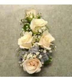 White Wristlet. An arrangement by Fink Flowers, Gifts and Flower Delivery.
