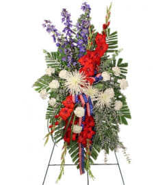 FSN-SALUTE TO A SERVICE MEMBER. An arrangement by Erika's Flowers.