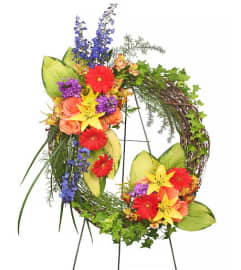 FSN- BRILLIANT SYMPATHY WREATH. An arrangement by Erika's Flowers.