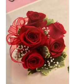 WRISTLET RED ROSES. An arrangement by Fink Flowers, Gifts and Flower Delivery.