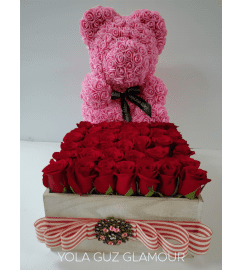 Channel Roses and Bear. An arrangement by Brickell Exclusive Blooms.