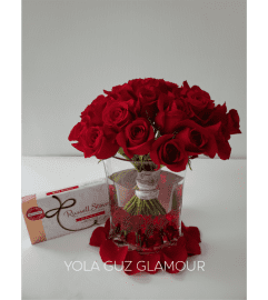 Red Roses And Chocolates. An arrangement by Brickell Exclusive Blooms.