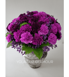 Purple Carnations In a Vase. An arrangement by Brickell Exclusive Blooms.