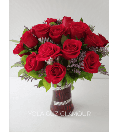 Red Roses in Red Vase. An arrangement by Brickell Exclusive Blooms.