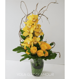 Cymbidium Orchids and Roses. An arrangement by Brickell Exclusive Blooms.