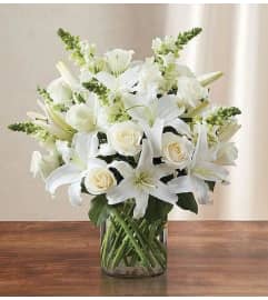 Beautiful Vase in White. An arrangement by Aventura Glamour Flowers. Beautiful Vase in White. An arrangement by Aventura Glamour Flowers.