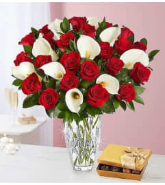 Red Roses With Calla Lilies And Chocolates. An arrangement by Aventura Glamour Flowers. Red Roses With Calla Lilies And Chocolates. An arrangement by Aventura Glamour Flowers.