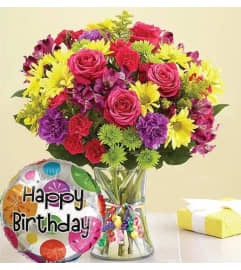 Birthday Celebration Vase. An arrangement by Aventura Blooming Petals.