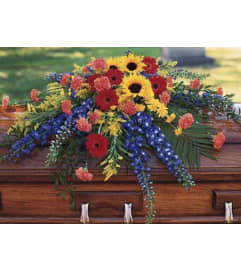 A Tranquil Peace Casket Spray. An arrangement by Seasons Change Designs.