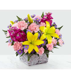 bright sunny lights. An arrangement by Geni's Florist and Gifts.