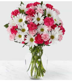 sweet and surprises. An arrangement by Geni's Florist and Gifts.