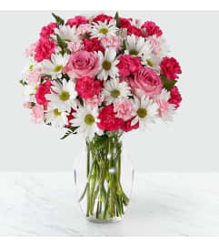 sweet and surprises. An arrangement by Geni's Florist and Gifts.