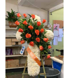 Orange Cross. An arrangement by Massey's House of Flowers.