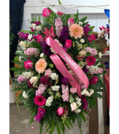 Pinks Lavs and Whites Standing Spray. An arrangement by Massey's House of Flowers.