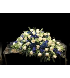 Casket Blue and White. An arrangement by Massey's House of Flowers.