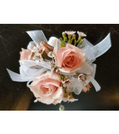 Pink Spray Rose Corsage. An arrangement by Northwest Florist.
