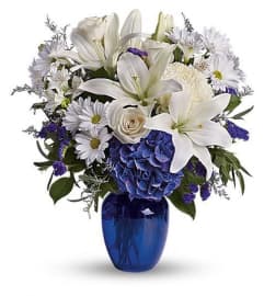 BEAUTIFUL IN BRGHT BLUE AND WHITE. An arrangement by Elegant Florist.