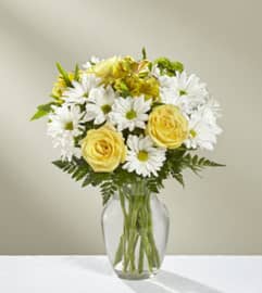 The FTD Sunny Sentiments Bouquet Vase Arrangement. An arrangement by Balloon Bouquets Plus.