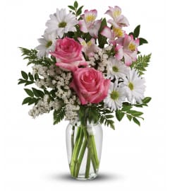 What a Treat Bouquet With Roses Vase Arrangement. An arrangement by Balloon Bouquets Plus.