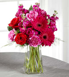 The FTD Blushes of Pink Vase Arrangement. An arrangement by Balloon Bouquets Plus.