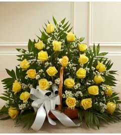 FIRESIDE BASKET YELLOW ROSES. An arrangement by Elegant Florist.