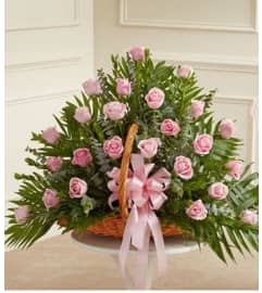 FIRESIDE BASKET PINK ROSES. An arrangement by Elegant Florist.