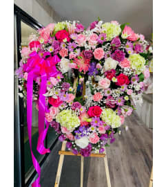 Garden lilac heart. An arrangement by Geni's Florist and Gifts.