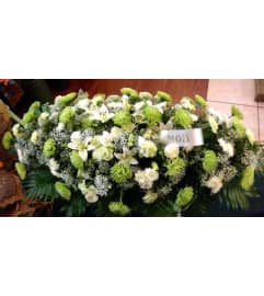 Lovely green casket spray. An arrangement by Flowers in Bloom.