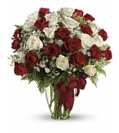 White and Red Roses Arranged. An arrangement by Anthurium Gardens Florist.