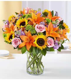 Sunflowers In A Garden. An arrangement by Brickell Exclusive Blooms.