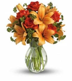 Fiery Orange Lily and Rose. An arrangement by Farmside Florist.