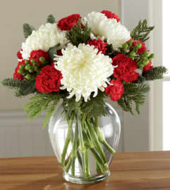 The FTD Holiday Enchantment. An arrangement by Balloon Bouquets Plus.