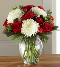 The FTD Holiday Enchantment. An arrangement by Balloon Bouquets Plus.