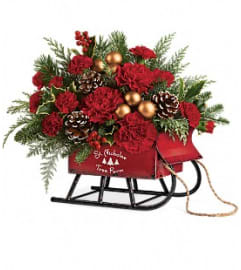 vintage sleigh teleflora. An arrangement by Stettler Flowers.